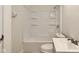 Bathroom featuring a shower over tub, white sink and toilet at 3242 Welch Dr, Indianapolis, IN 46224