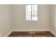 Bedroom with wood flooring, white walls and a large window at 3242 Welch Dr, Indianapolis, IN 46224
