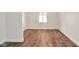 Bright bedroom features wood-look flooring, white trim, and natural light at 3242 Welch Dr, Indianapolis, IN 46224