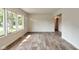 Bright and airy living room with large windows and durable wood-look flooring at 3242 Welch Dr, Indianapolis, IN 46224