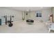 Spacious basement featuring workout equipment, toys, and natural light from a window at 3876 Kegler Way, Carmel, IN 46074