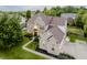 Stunning brick home with a manicured lawn, mature trees, and attached garage at 3876 Kegler Way, Carmel, IN 46074