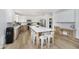 Bright eat-in kitchen with stainless appliances, island with breakfast bar, and two-tone cabinetry at 3876 Kegler Way, Carmel, IN 46074