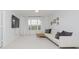 Inviting living room with a large window and stylish white sofa at 3876 Kegler Way, Carmel, IN 46074