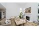 Spacious living room featuring a fireplace, wood floors, high ceilings, and lots of natural light at 3876 Kegler Way, Carmel, IN 46074