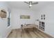 Bright office with a ceiling fan, wood floors, ample natural light, and built-in shelving at 3876 Kegler Way, Carmel, IN 46074