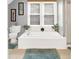 Bright bathroom featuring a soaking tub and large window at 3940 E 57Th St, Indianapolis, IN 46220