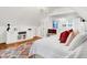 Bright bedroom featuring hardwood floors, custom built-ins, and a decorative chandelier at 3940 E 57Th St, Indianapolis, IN 46220