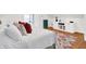 Light, bright bedroom with hardwood floors, colorful area rug, and comfortable bedding at 3940 E 57Th St, Indianapolis, IN 46220