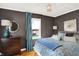Bedroom with hardwood floors, blue curtains, and decorative lamp at 3940 E 57Th St, Indianapolis, IN 46220