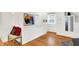 Hallway featuring a sitting bench, storage cabinets and hardwood floors at 3940 E 57Th St, Indianapolis, IN 46220