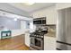 Kitchen featuring stainless steel appliances including a gas range with matching microwave at 3940 E 57Th St, Indianapolis, IN 46220