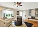 Comfortable living room with a ceiling fan, lots of natural light, and contemporary decor at 3940 E 57Th St, Indianapolis, IN 46220