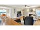 Open-concept living and dining area with hardwood floors and modern decor at 3940 E 57Th St, Indianapolis, IN 46220