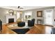 Inviting living room featuring a fireplace, hardwood floors, and ample natural light at 3940 E 57Th St, Indianapolis, IN 46220