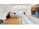 Stylish main bedroom with vaulted ceiling, chandelier, and hardwood floors at 3940 E 57Th St, Indianapolis, IN 46220