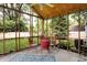 Charming screened porch with brick floors and lovely outdoor views at 3940 E 57Th St, Indianapolis, IN 46220