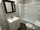 Bathroom featuring a shower-tub combo and a modern vanity at 4343 W Fairview Rd, Greenwood, IN 46142