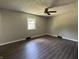 Bedroom with vinyl flooring, a window, and neutral paint at 4343 W Fairview Rd, Greenwood, IN 46142