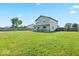 Expansive backyard with lush green grass, providing a perfect area for outdoor fun and relaxation at 4605 Clairmont Dr, Columbus, IN 47203