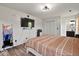 Spacious bedroom with modern lighting, TV, and a comfortable bed perfect for relaxation and rest at 4605 Clairmont Dr, Columbus, IN 47203