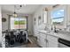 Bright dining area featuring white cabinets, modern fixtures, and ample natural light creating a pleasant ambiance at 4605 Clairmont Dr, Columbus, IN 47203