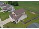 A charming home featuring neutral siding and a large, fenced backyard with green grass at 4605 Clairmont Dr, Columbus, IN 47203