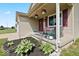 Charming front porch featuring decorative plants, stylish decor, and a welcoming entrance at 4605 Clairmont Dr, Columbus, IN 47203