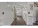 Bright hallway with wood floors, decorative touches, and a barn door to another room at 4605 Clairmont Dr, Columbus, IN 47203