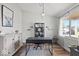 Bright home office featuring wood floors, large window, and neutral decor creating a productive workspace at 4605 Clairmont Dr, Columbus, IN 47203