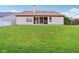 Back of the house showing a well-maintained lawn and screened in porch at 4933 Common Vista Way, Indianapolis, IN 46220