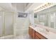 Well-lit bathroom with double vanity, tub and shower, offering convenience and style at 4933 Common Vista Way, Indianapolis, IN 46220