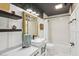 Stylish bathroom featuring a modern vanity with vessel sink and bathtub with subway tile surround at 4933 Common Vista Way, Indianapolis, IN 46220
