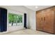 Clean and spacious bedroom with a large window, vaulted ceiling and built-in storage at 4933 Common Vista Way, Indianapolis, IN 46220