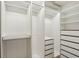 Well-organized walk-in closet featuring custom shelving and drawers, providing ample storage space at 4933 Common Vista Way, Indianapolis, IN 46220