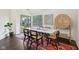 Bright dining room featuring a modern table, stylish seating, and sliding glass doors to the outdoors at 4933 Common Vista Way, Indianapolis, IN 46220