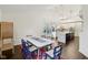 Open dining room flowing into a well-appointed kitchen and featuring a large table and bright natural light at 4933 Common Vista Way, Indianapolis, IN 46220