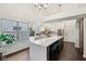 Contemporary kitchen showcasing a spacious island, sleek countertops, and modern stainless steel appliances at 4933 Common Vista Way, Indianapolis, IN 46220