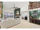 Spacious living room with a fireplace, comfortable seating, and an abundance of natural light at 4933 Common Vista Way, Indianapolis, IN 46220