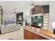 Open-concept living room with fireplace, unique shelving, and a large sofa at 4933 Common Vista Way, Indianapolis, IN 46220