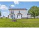Spacious backyard featuring a fire pit, a patio with seating, and a well-maintained lawn for relaxation and entertainment at 5030 E 800 N, Columbus, IN 47203