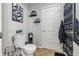 Bright bathroom featuring a toilet, modern decor, and herringbone-patterned flooring at 5030 E 800 N, Columbus, IN 47203