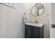 Chic powder room with navy vanity, gold fixtures, and decorative mirror at 5030 E 800 N, Columbus, IN 47203