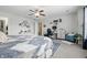Cozy bedroom featuring a king bed, ceiling fan, desk, and charming decor at 5030 E 800 N, Columbus, IN 47203