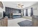 Spacious bedroom with a bunk bed, ceiling fan, and stylish accent wall at 5030 E 800 N, Columbus, IN 47203