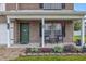 Inviting front porch with cozy seating and decorative plants at 5030 E 800 N, Columbus, IN 47203