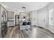 Modern kitchen boasts gray cabinets, stainless appliances, and kitchen island with barstool seating at 5030 E 800 N, Columbus, IN 47203