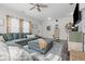 Bright living room with stylish cabinets, decorative accents, and wood flooring at 5030 E 800 N, Columbus, IN 47203