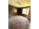 Spacious bedroom featuring neutral carpeting, modern fan, and a large window at 514 W 6Th St, Sheridan, IN 46069
