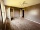 Bright bedroom with large window, modern ceiling fan, and closet in view at 514 W 6Th St, Sheridan, IN 46069
